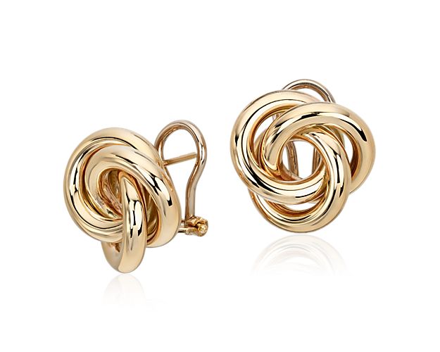 An iconic look goes bold in these oversized love knot stud earrings. These Italian-crafted earrings in timeless 14k yellow gold feature a high polished finish and secure omega back closures.