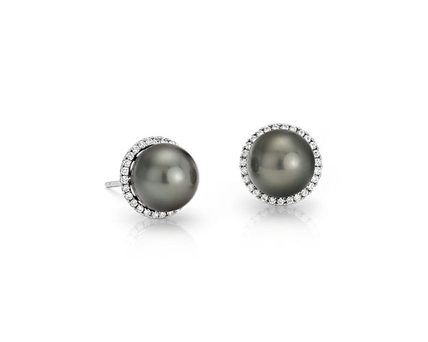 With a flash of brilliance, these Tahitian cultured pearl and diamond earrings take classic up a notch. Two lustrous black pearls are surrounded by a subtly glittering halo of round diamonds set in polished 14k white gold for a look that's both easy and elegant.