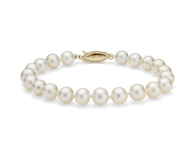 Nearly round, these freshwater cultured pearls are strung securely on a 7.5" hand-knotted silk blend cord and secured with a 14k yellow gold safety clasp.