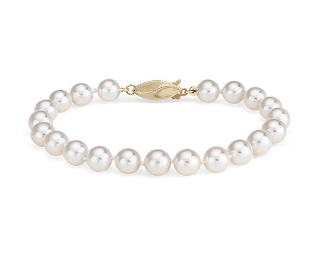 Our lustrous Classic Akoya cultured pearl bracelet is strung with a 6.5" hand-knotted silk blend cord, secured with an 18k yellow gold safety clasp.