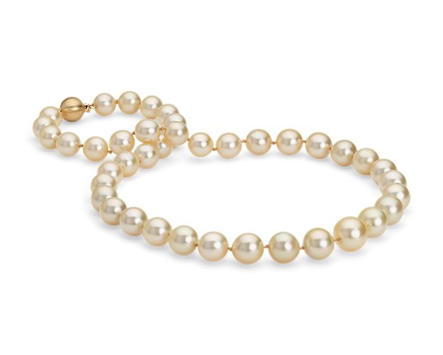 Redefine a timeless style with the opulence of this strand of golden South Sea cultured pearls. The hand-knotted silk blend strand is finished with a 18k yellow gold matte safety clasp.
