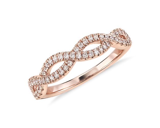 This beautiful and delicate wedding ring is designed with two rows of micropavé set diamonds intricately intertwined for an elegant statement.