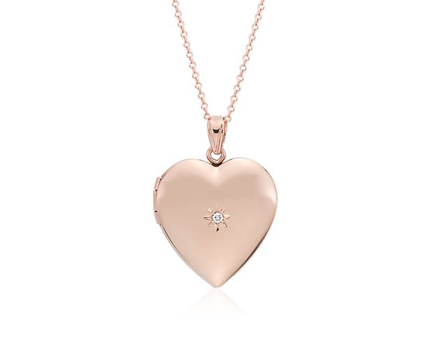 This beautiful, heart-shaped locket is crafted in lightweight 14k rose gold with a delicate diamond detail. The locket can hold two photographs to create the perfect keepsake she will wear close to her heart.
