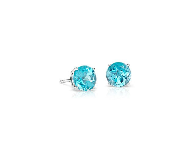 Delightfully colorful, these hand-selected gemstone earrings feature vibrant blue topaz gemstones complemented by 14k white gold four-prong settings.