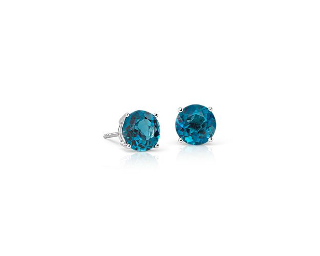 Delightfully colorful, these hand-selected gemstone earrings feature London blue topaz gemstones complemented by 14k white gold four-prong settings.