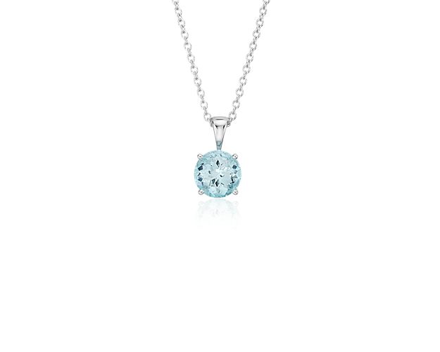 Vibrant and colorful, this gemstone pendant features a shimmering pale blue aquamarine set in a 14k white gold four-prong setting suspended from a dainty 18-inch cable chain. A classic piece of everyday luxury and is the birthstone for March.