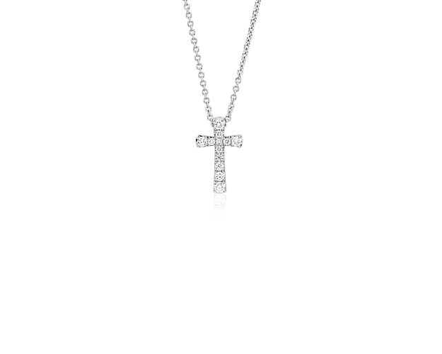 Beautifully crafted, this petite diamond pendant features round diamonds set in a dainty cross design of 14k white gold with a matching cable chain necklace.
