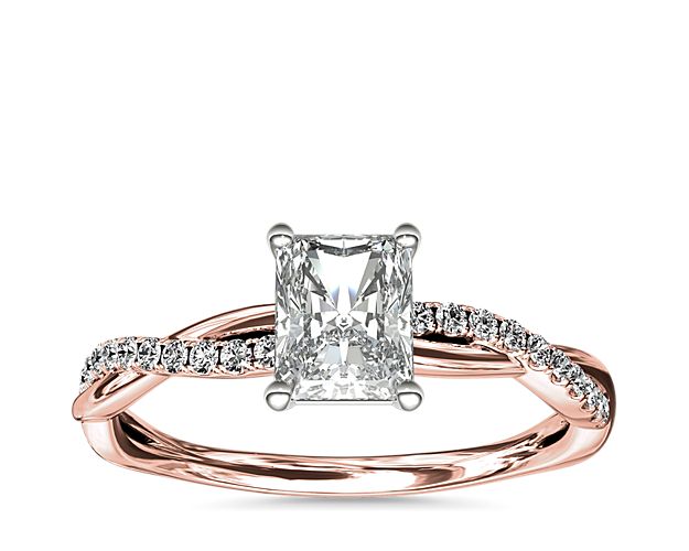 Classic with a twist, this 14k rose gold engagement ring features a delicate twist of pavé-set diamonds that will complement the center diamond of your choice.