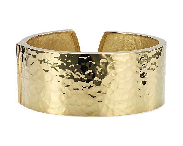 This 18k yellow gold cuff bracelet makes a striking impact. Italian-crafted with a hammered texture and satin finish, this glowing cuff bracelet adds a modern, organic finish to day or night.