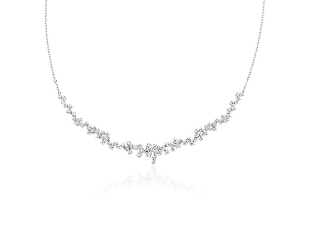 A beautifully crafted piece that mixes elegance with contemporary design, the scattered diamond design of this 14k white gold necklace features 1 1/2 carats of round-cut diamonds and is sure to turn heads.