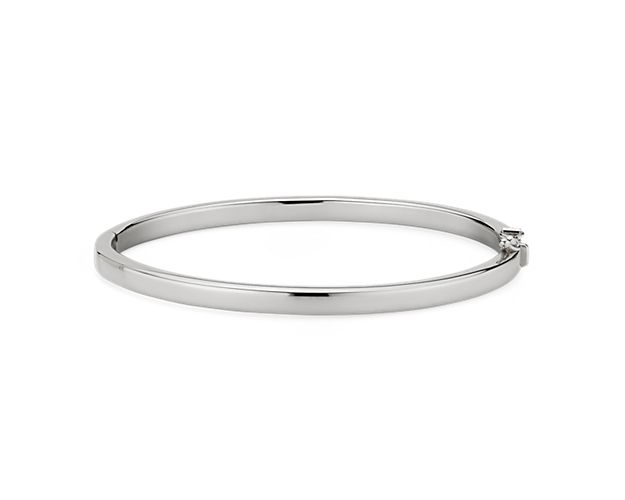 Go for a bold and bright look with this Italian crafted squared hinged bangle bracelet. Crafted in brightly polished 14k white gold, this bracelet is lightweight yet looks substantial. A statement piece on its own, or stack with other bracelets for an on-trend look.