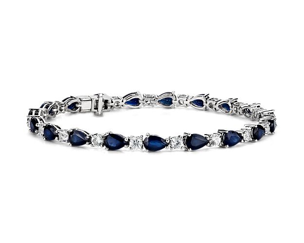 Captivating in color, this bracelet features vibrant sapphire gemstones accented with sparkling round white sapphires framed in 14k white gold.