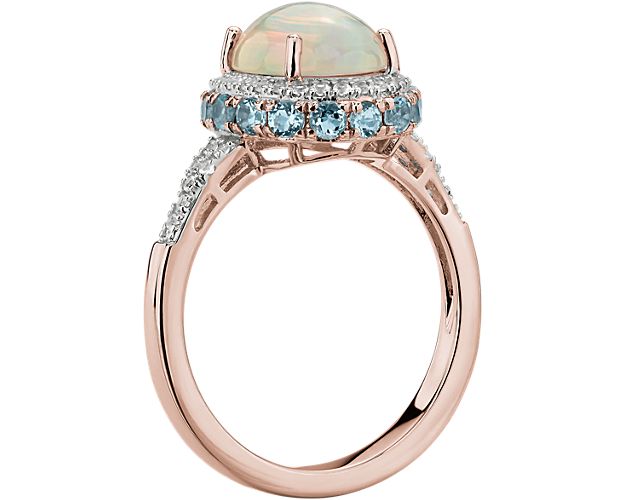 Oval Opal And Swiss Blue Topaz Halo Ring In 14k Rose Gold