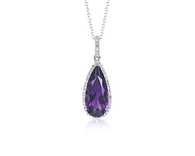 A teardrop-shaped amethyst wreathed in a light-catching halo of twinkling white topaz hangs from a coordinating cable chain that can be worn at 16- or 18-inches for just-right placement.