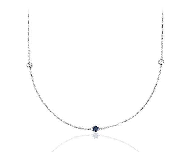 Bezel-set stations of richly hued sapphires and dazzling round-cut diamonds enliven this shimmering 14k white gold necklace.