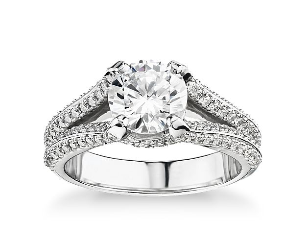 Make the moment brilliant with this dazzling platinum Bella Vaughan engagement ring. Twin pavé rows along a split shank culminate in a glittering halo around the breathtaking center diamond of your choice. Named after our hometown, this stunner boasts 3/4 total carat weight of smaller diamonds. This setting is custom made to fit your beautiful center stone.