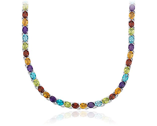 Simply dramatic, this necklace is crafted in sterling silver and features oval-shaped multicolor gemstones in a flexible single line design.