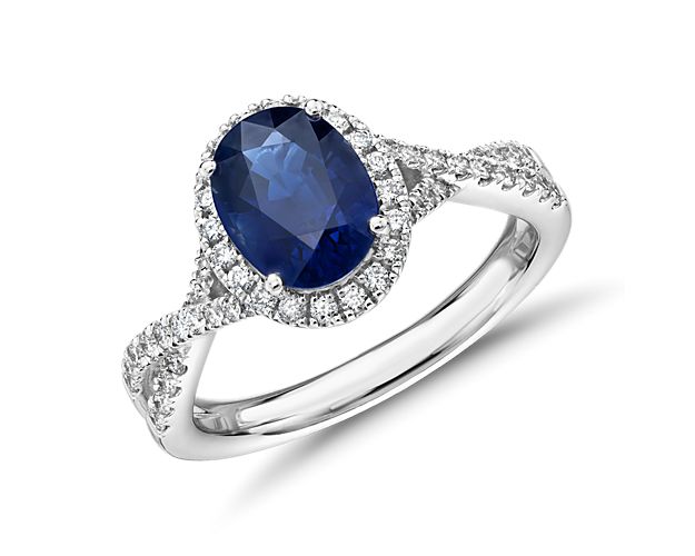If your gemstone desire burns for sapphire, this big, bold blue beauty will become a fast favorite. Surrounded by a framing halo of white diamonds, the blue comes on strong, and the twisting band set with more diamonds delivers the constant companionship of brilliant sparkle.