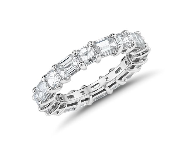 Let love shine eternally in brilliant fashion with a platinum eternity ring set with 8 emerald-cut diamonds alternating with 8 asscher-cut diamonds.