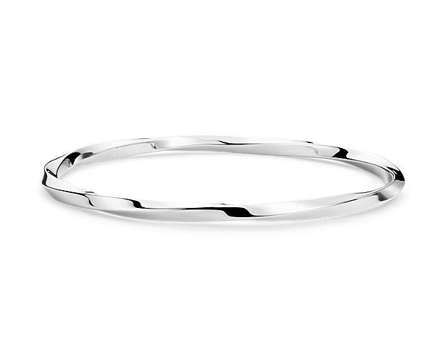 Simply chic, this round twisted bangle bracelet is crafted in sterling silver. Wear it alone or stacked with other bracelets, it's sure to impress.