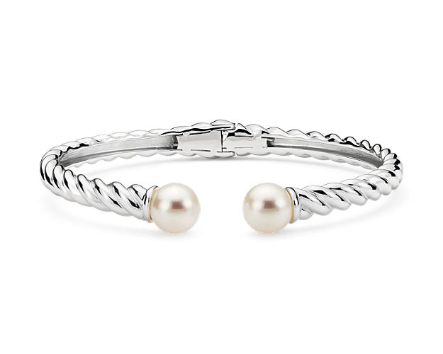 Crafted in sterling silver, this stackable hinge cuff is embellished with two freshwater cultured pearl stations.