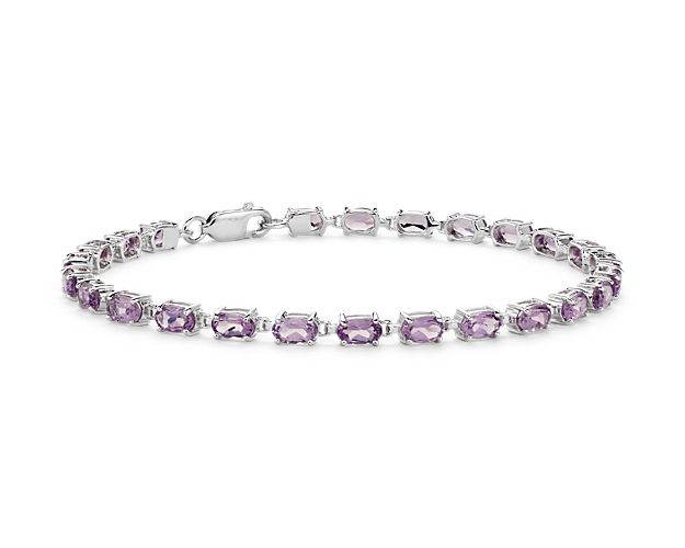 Truly bright and festive, this gemstone bracelet features vibrant amethyst gemstones framed in a delicate sterling silver setting.