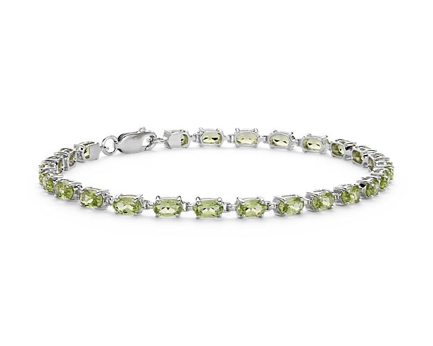 Truly bright and festive, this gemstone bracelet features vibrant peridot gemstones framed in a delicate sterling silver setting.