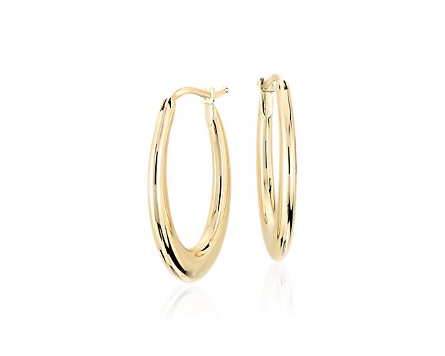 Effortlessly elegant, these lightweight, Italian-crafted, 14k yellow gold hoop earrings feature an elongated, hollow oval design for an incredibly wearable look. Polished and perfectly sized for everyday style.