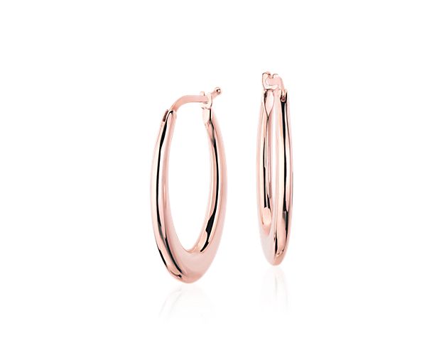 Effortlessly elegant, these lightweight, Italian-crafted, 14k rose gold hoop earrings feature an elongated, hollow oval design for an incredibly wearable look. Polished and perfectly sized for everyday style.