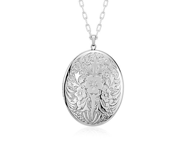 A touch of vintage style, this oval locket is crafted from sterling silver and features a floral motif. The perfect keepsake, this locket is strung on a matching cable 30 inch chain necklace. Engrave the back for a personalized touch.