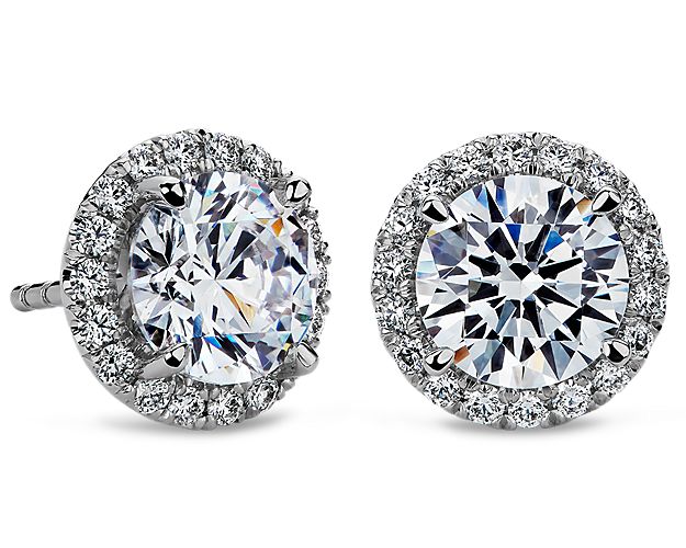 These elegant platinum earring settings will compliment the brilliance of your choice of round diamonds. Each earring is French pavé-set with round diamonds around the setting.
