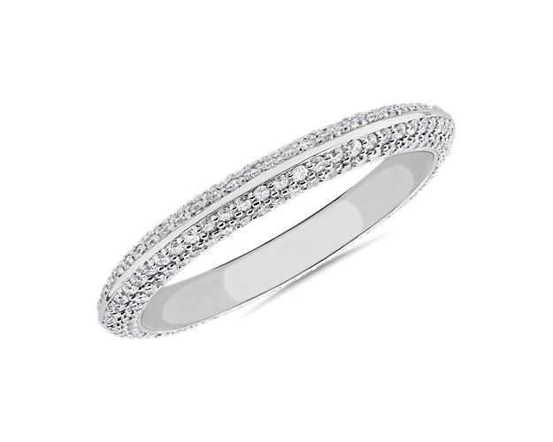 A sensational design that absolutely dazzles, this premium platinum diamond ring displays a knife-edge exhibiting remarkable sparkle from the rows of micro pavé diamonds set along the band.  A perfect match with stock number 71083.