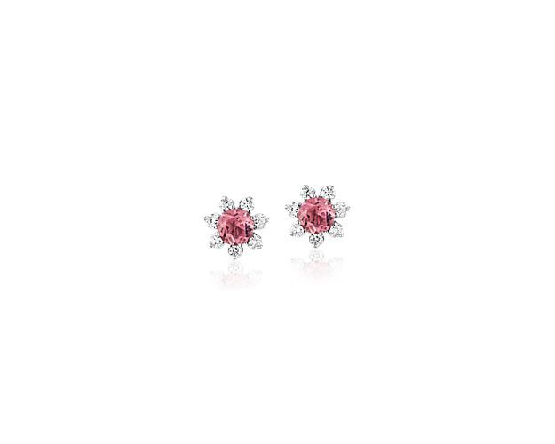 Each of these eye-catching 14k white gold stud earrings feature a single pink tourmaline stone surrounded by a blossom halo of brilliant diamonds for a look that’s both colorful and chic.