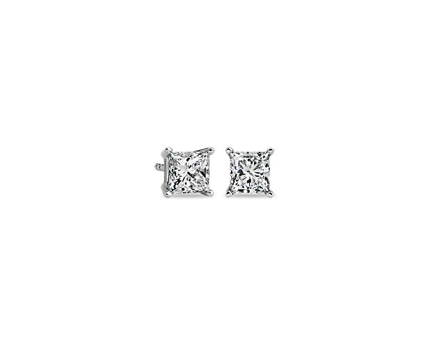 Brilliance is captured in these diamond stud earrings showcasing princess cut diamonds in four-prong settings of 14k white gold with guardian backs and posts. The pair amounts to a 1.5 carat total diamond weight.
