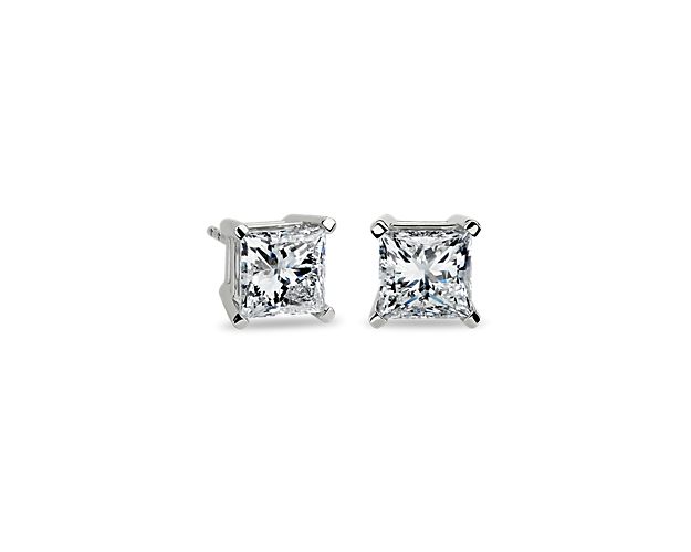 Brilliance is defined by these diamond stud earrings showcasing four-carat princess-cut diamonds (4 ct. tw.) embraced by a 14k white gold four-prong setting with guardian backs.