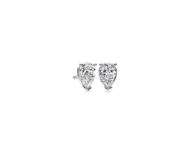 Beautifully matched, these stud earrings feature near-colorless pear shaped diamonds set in 14k white gold four-prong settings with push backs and posts. Each earring weighs roughly 1/2 carat, for a total diamond weight of 1 carat.