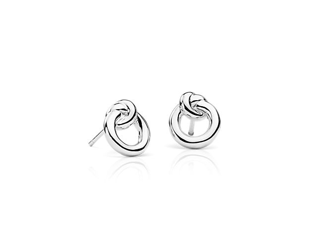 Crafted with stylish sophistication, these sterling silver stud earrings features a delicately knotted circle to signify 'harmony'. The perfect gift for the one you love.