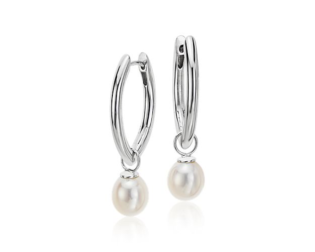 Unique in shape, these marquise hoops are crafted in sterling silver with delicate freshwater cultured pearl drops. These multifunctional earrings can be worn with or without the pearl making them the perfect versatile earring.