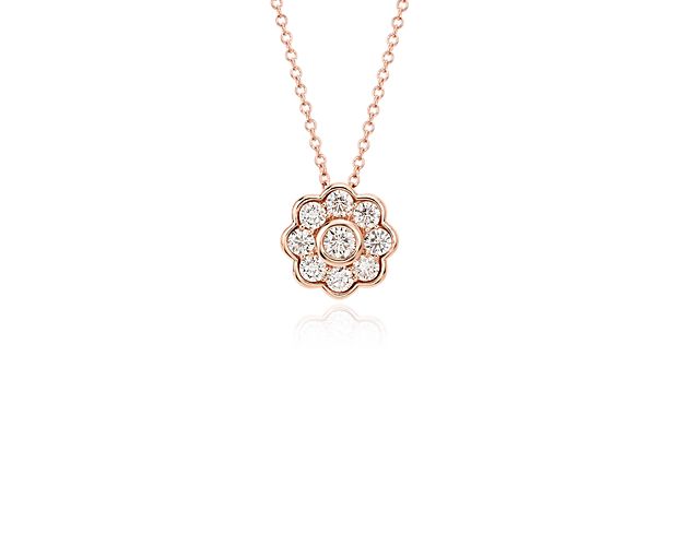 Pretty in pink, this organic floral pendant is a one-of-a-kind showcase for these round brilliant diamonds framed in 18k rose gold.