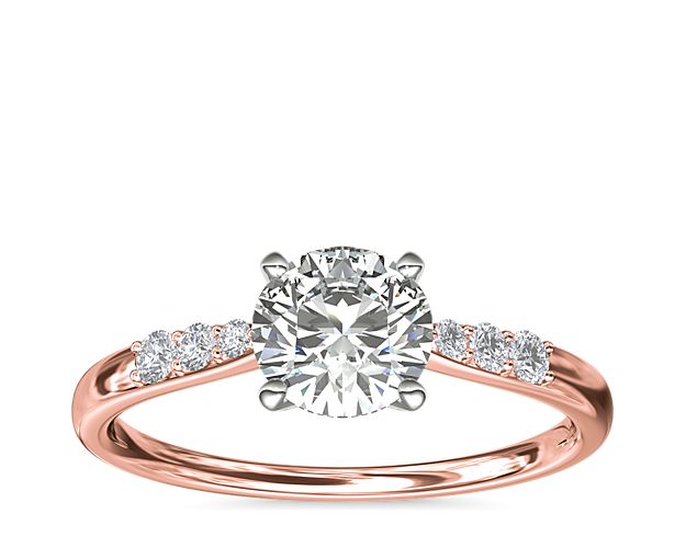 Compliment your center diamond perfectly with this 14k rose gold engagement ring accented with pavé-set diamonds along the shank.