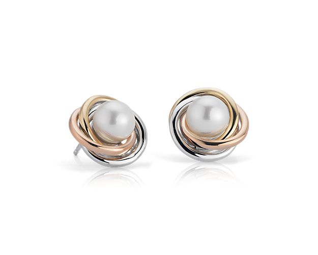 With a freshwater pearl surrounded by three intertwining rings of 14k white gold, 14k yellow gold and 14k rose gold, these love knot earrings create a fresh design twist destined to delight.