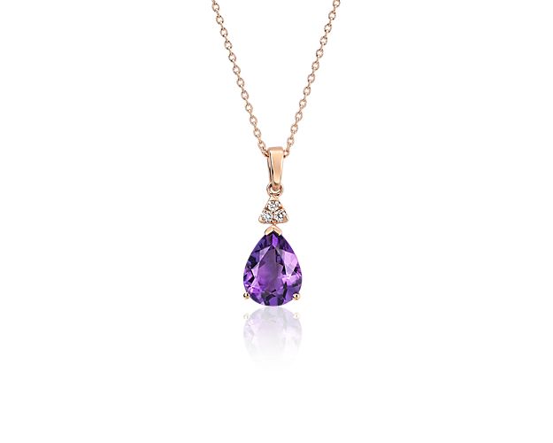 Both regal and deeply hued, this pear-shaped amethyst pendant is emboldened by a crown of three round-cut diamonds. Framed by a 14k rose gold setting and matching adjustable cable chain, this stunning pendant is beauty come to life.