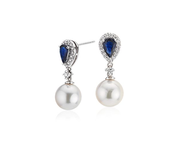 Striking in color and sparkle, this combination of Akoya cultured pearls, pear-shaped blue Sapphires and diamond detail merge with 14k white gold to create a pair of drop earrings sure to standout in any setting.