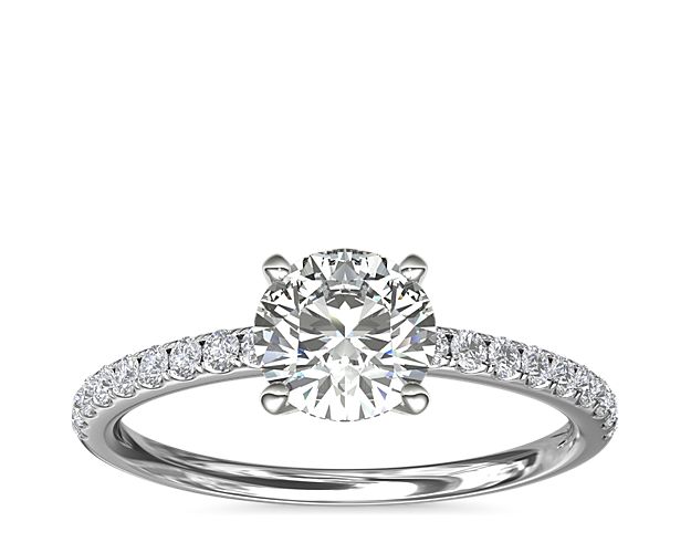 Classic elegance, this diamond engagement ring setting features pavé-set round brilliant diamonds mounted in enduring platinum.