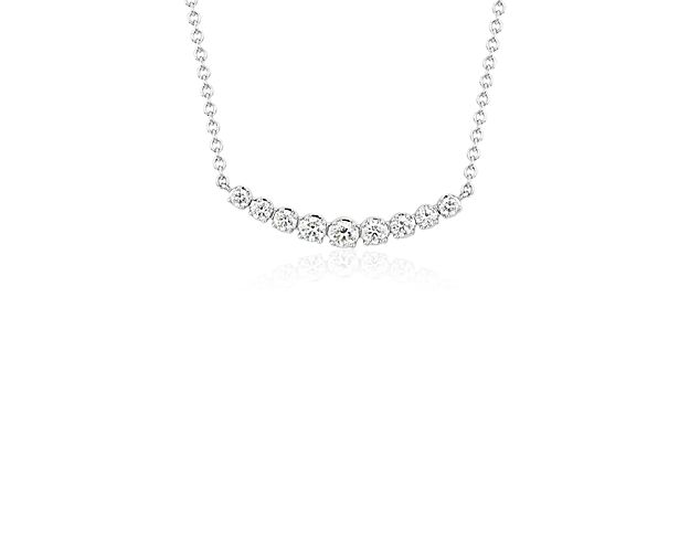 A covetable classic, this petite, curved diamond necklace features nine graduated diamonds that rest beautifully at the collarbone.
