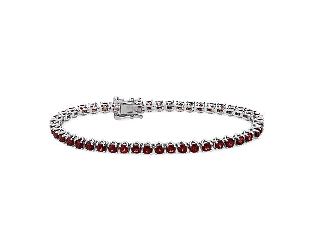 Add a touch of sparkle to your wrist with this classic tennis bracelet crafted from sterling silver and featuring a 3mm width. Deep, rich red garnets sparkle dramatically  along its length.