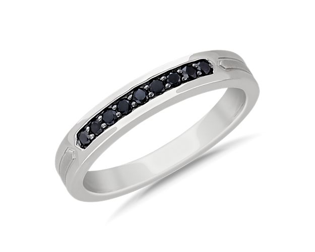 Round black diamonds are the central focus for this modern wedding band. Set in 14k white gold, geometric inlays on the side complete this clean look.