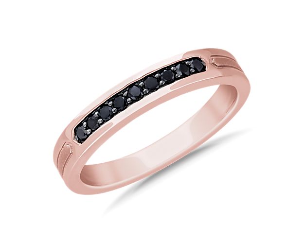 Round black diamonds are the central focus for this modern wedding band. Set in 14k rose gold, geometric inlays on the side complete this clean look.