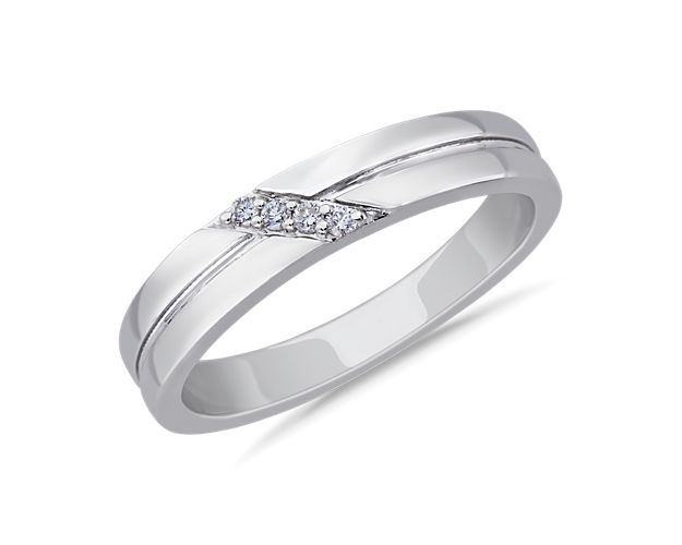 Bright diamonds are set in a beautifully angled diagonal along the front of this ring. It is crafted from luxurious 14k white gold that promises an enduring gleam.