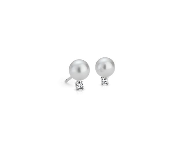 Subtle undertones of rose characterize our freshwater cultured pearls, each accented by a single round diamond and mounted on 14k white gold posts with push backs.